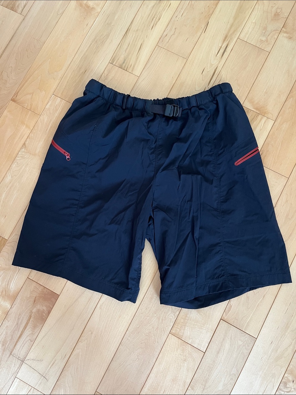 Arc'teryx Black Athletic Shorts with Red Zipper Accents